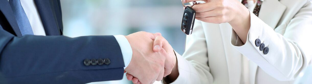 Worker and customer performing handshake, exchanging keys