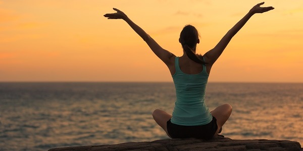 Woman meditating outdoors