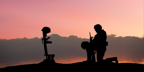 Military hat in front of an American flag