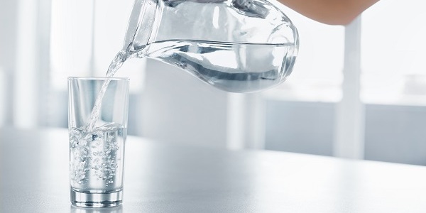 Pouring water in a glass