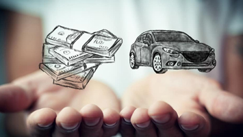 Money and car in palm of hands