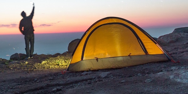 Person camping outdoors