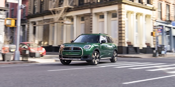 2027 MINI Countryman S ALL4 turning corner in the city