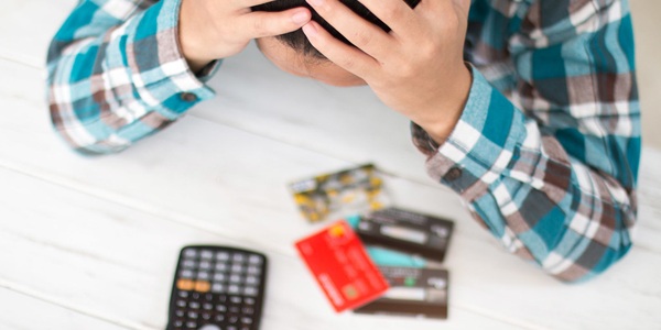 Frustrated person with credit cards