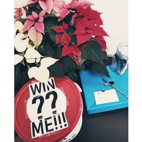 Flowers with "Win ?? Me!!!" written near them